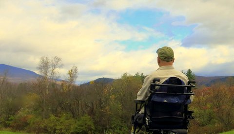 dan gilman looking at the mountains and forest near rutland vt 